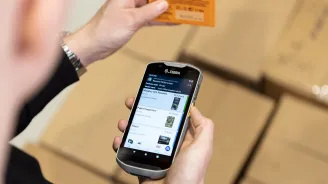 Person using a Mobile Barcode scanner in a warehouse - Mobile WMS for Microsoft Dynamics 365 Business Central 